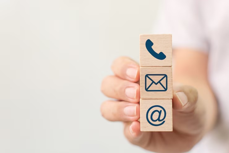hand-holding-wooden-block-cube-symbol-telephone-email-address-website-page-contact-us-e-mail-marketing-concept_20693-274